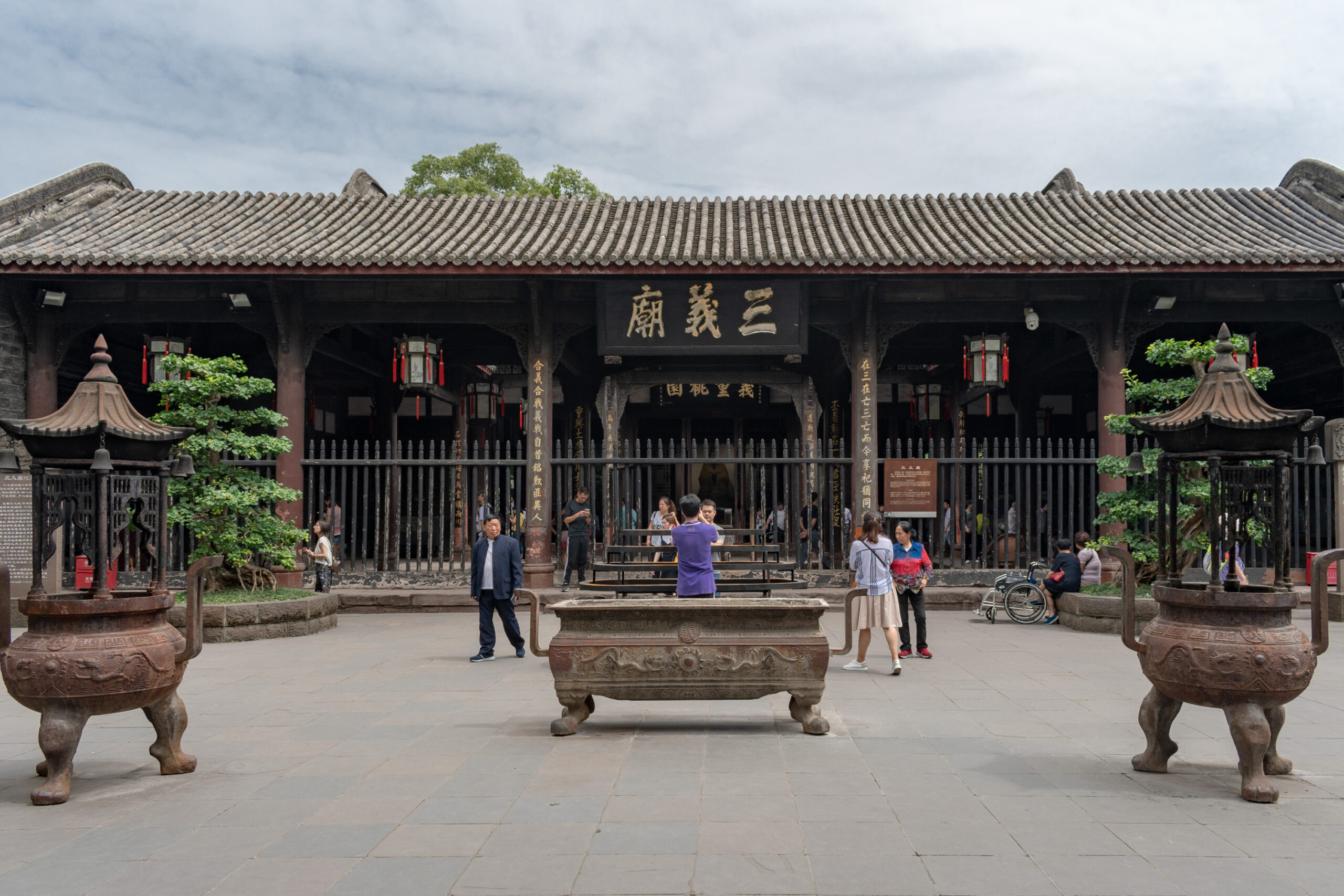 Visitors in the courtyard of Sanyi Temple within Chengdu's Wuhou Shrine complex