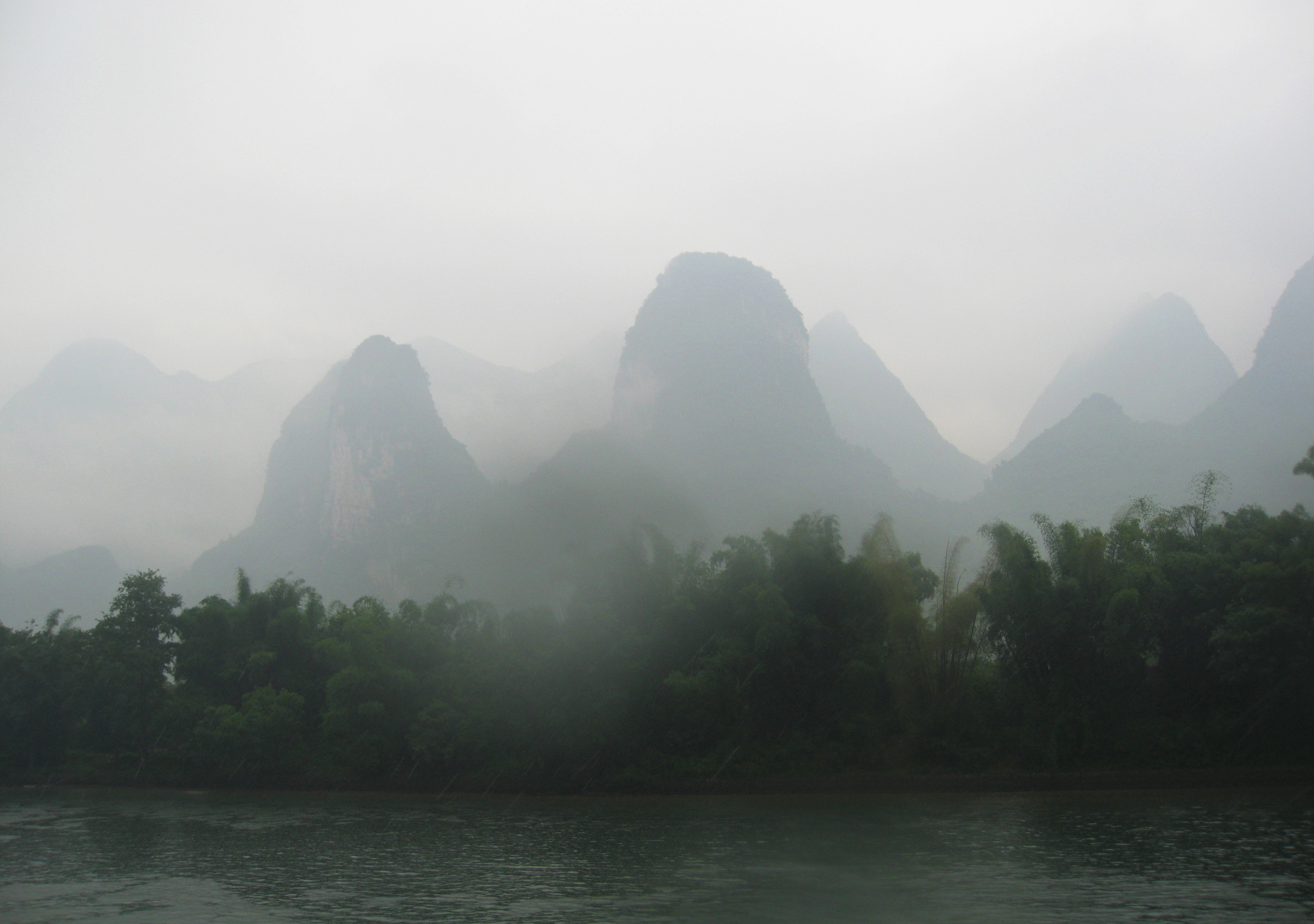 Li River and mist-covered limestone peaks near Guilin