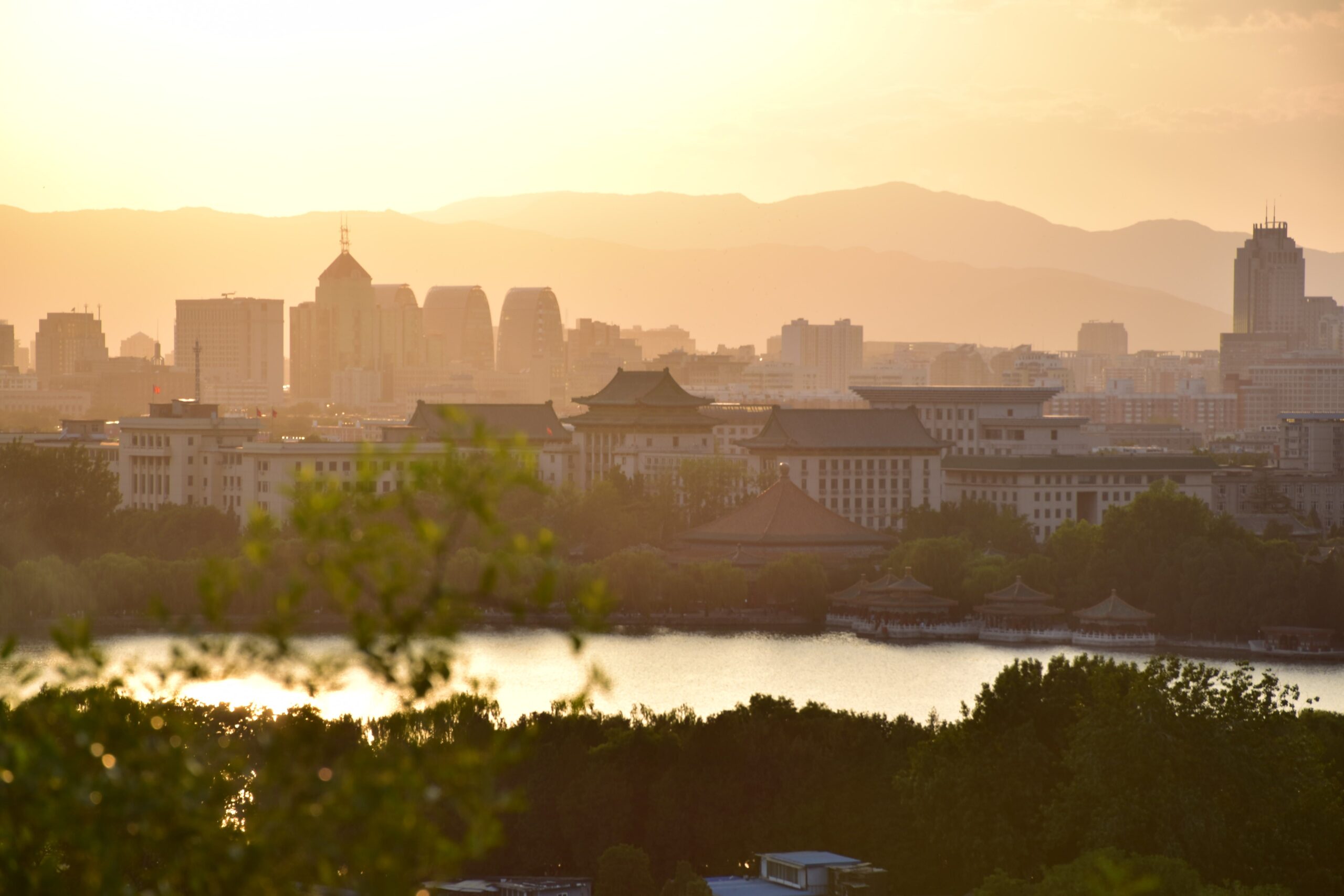 Beijing skyline and surrounding mountains at sunset
