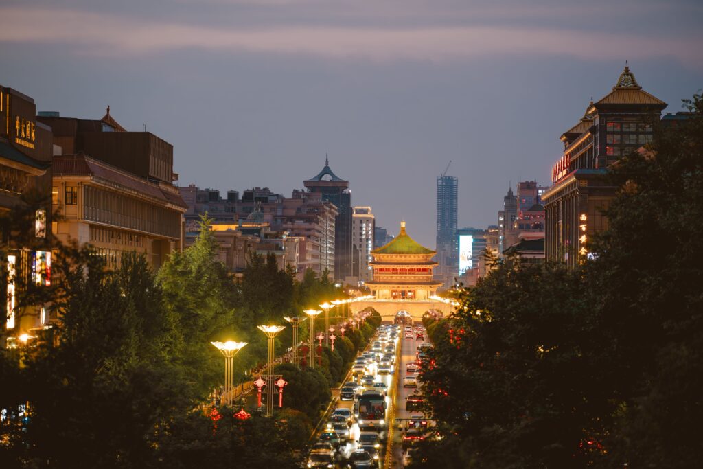 Xi'an Bell Tower illuminated at blue hour above surrounding city streets